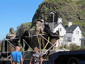 Game of Thrones film location Downhill Northern Ireland lifting one of the 'old gods' sculptures